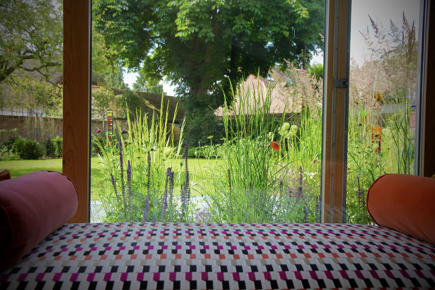 View of a Oxford garden in summer through glass 