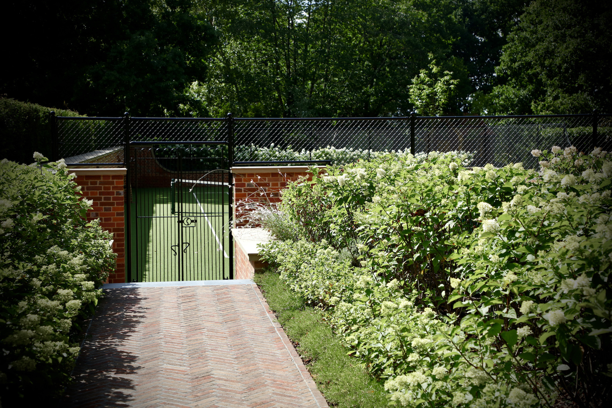 Harpsden wood house herringbone path leading to tennis courts