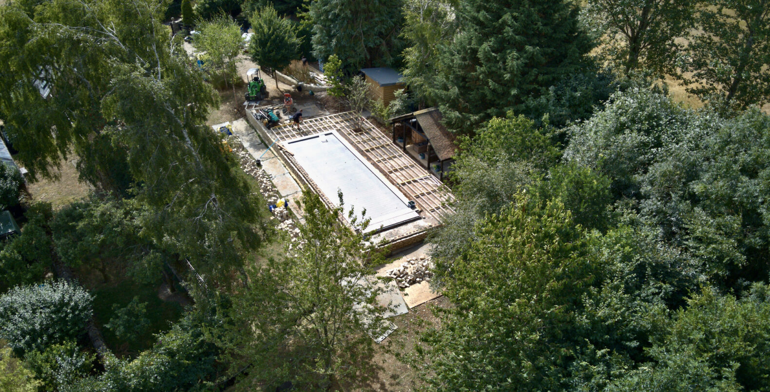 swimming pool seen from above the trees