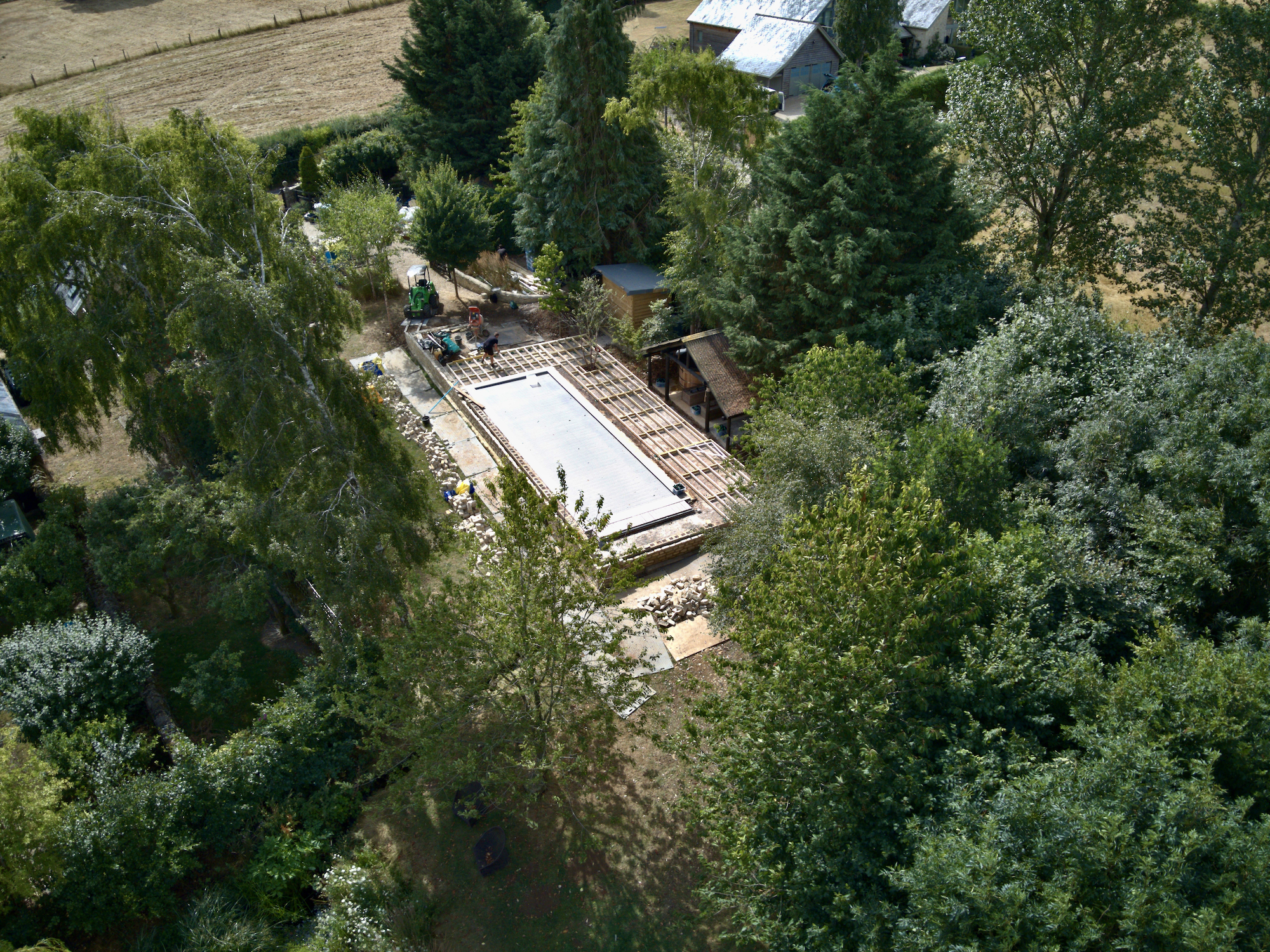 swimming pool seen from above the trees