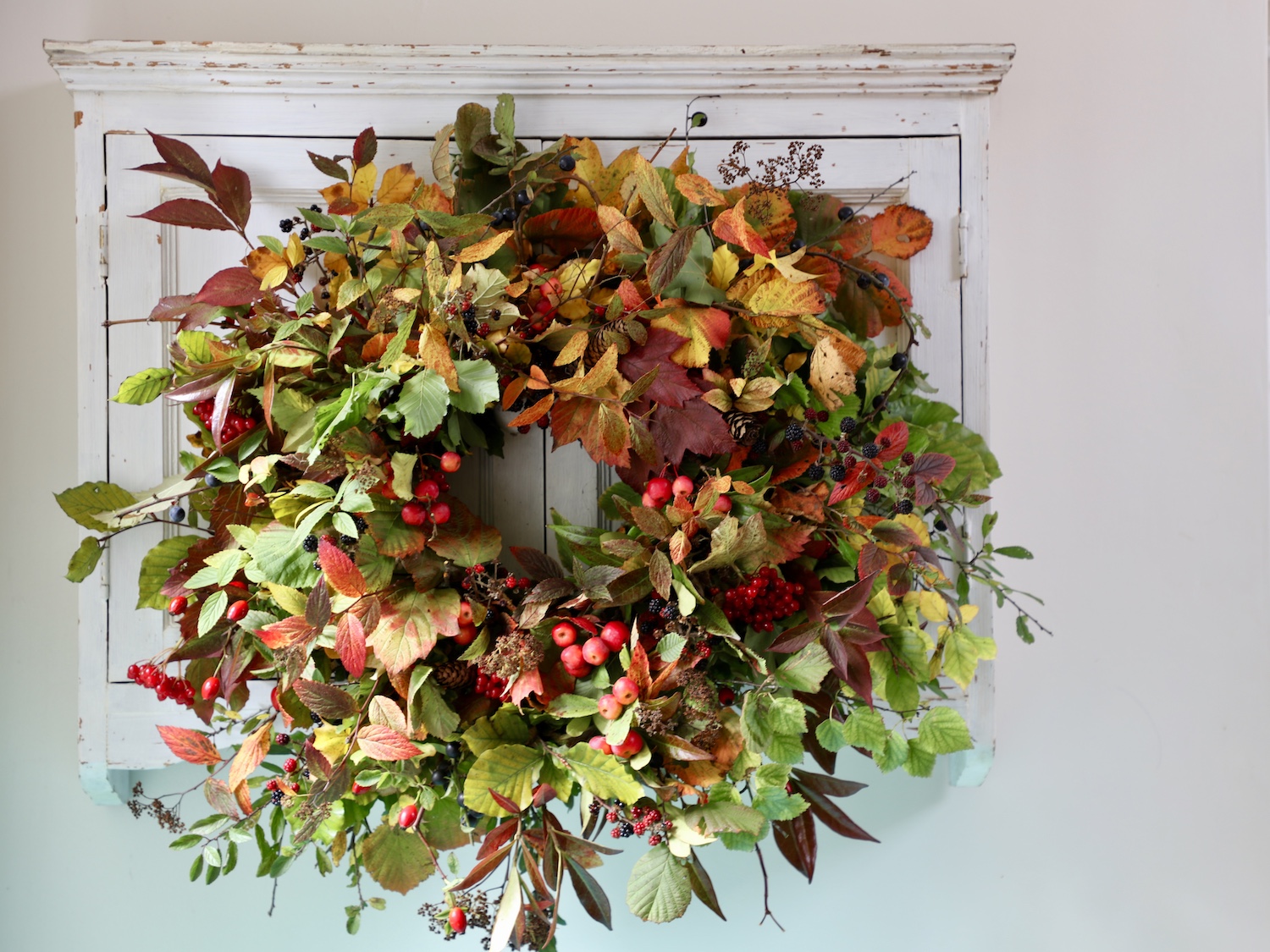 Epic autumnal wreath packed with berries, foliage and autumnal colours