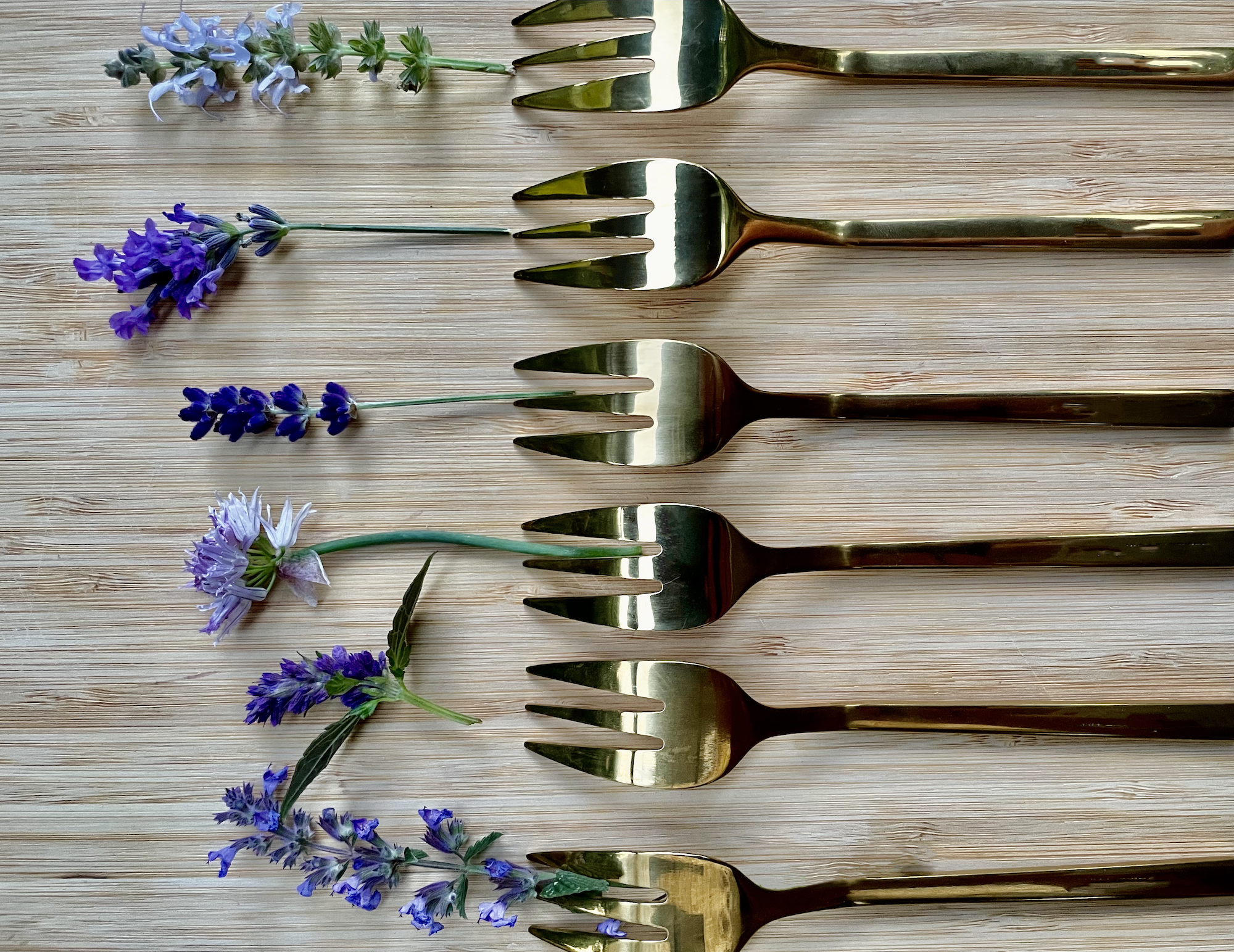 Gold forks with lavender and edible flowers