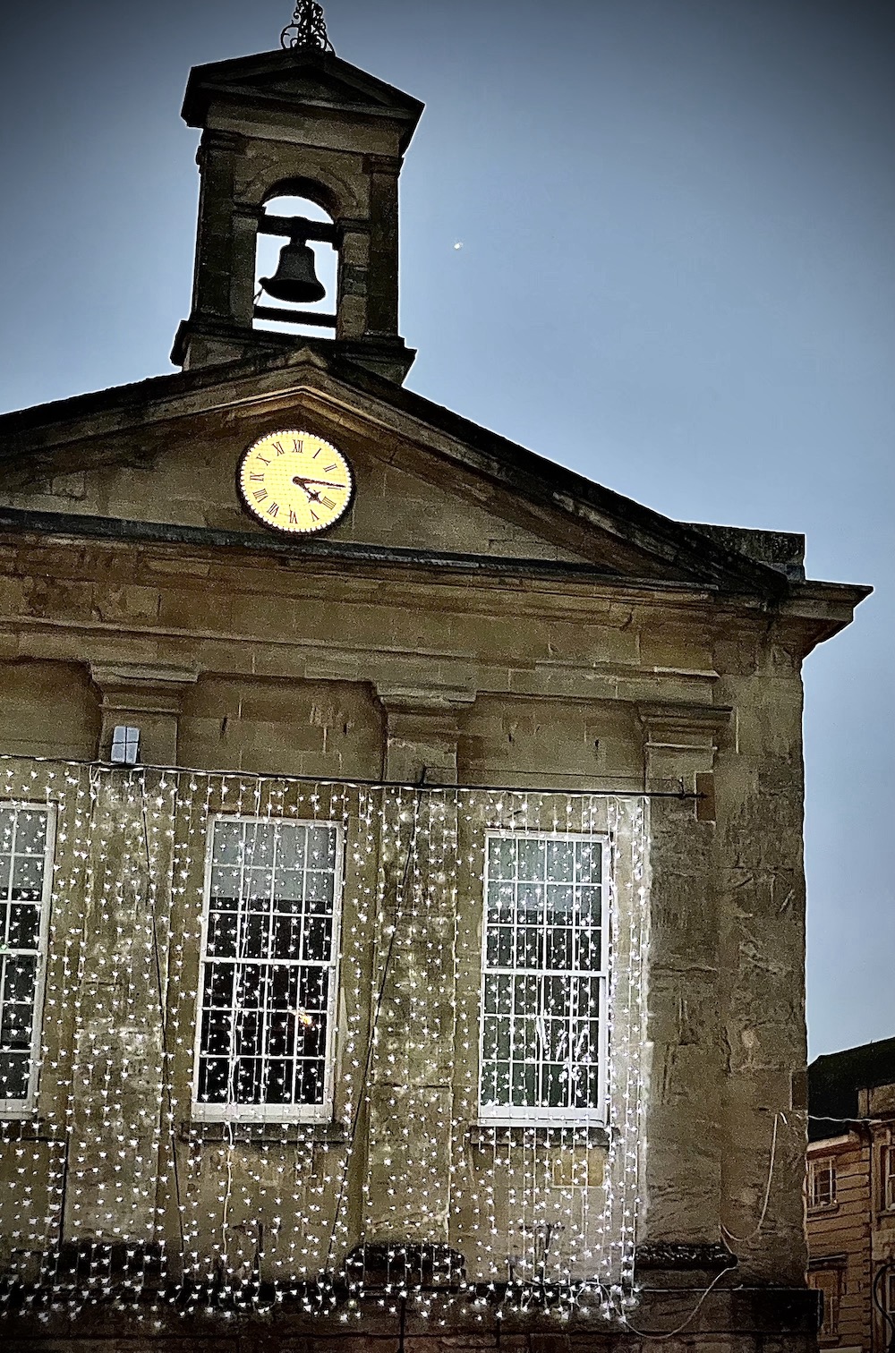 Chipping norton christmas lights on town hall with big town bell and clock