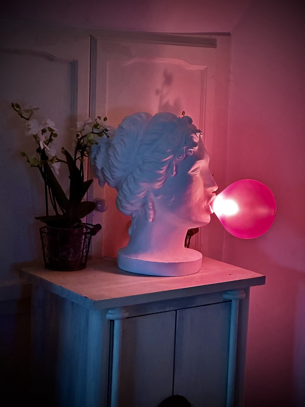 Pink balloon light and head sculpture at The rolling hound homestead 