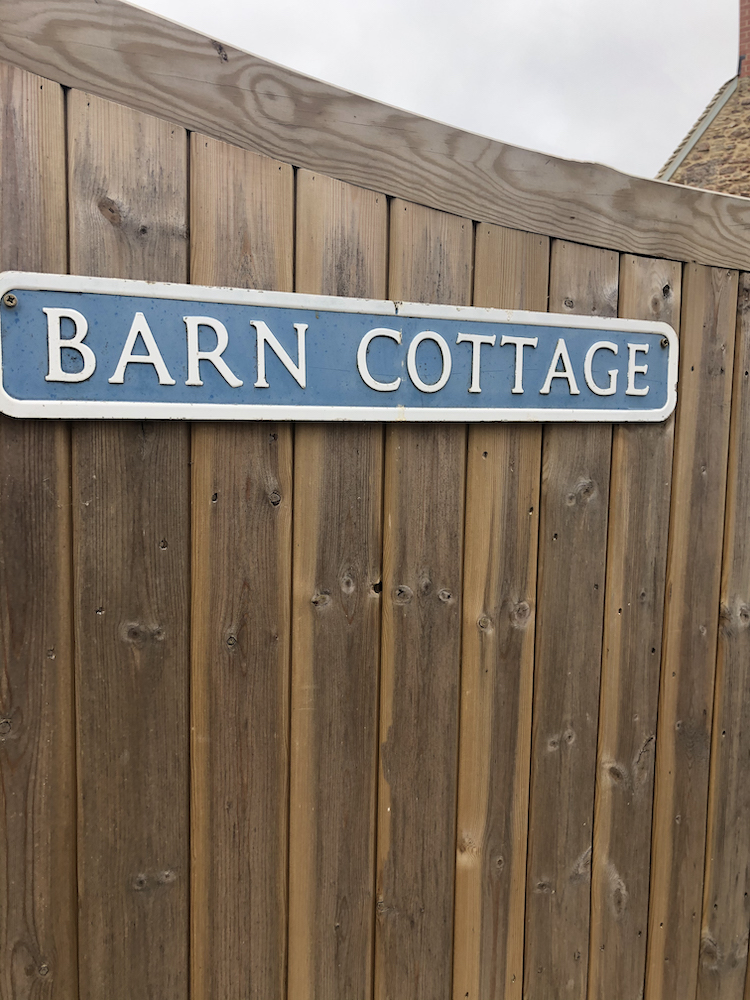 Barn cottage house sign on wooden gate