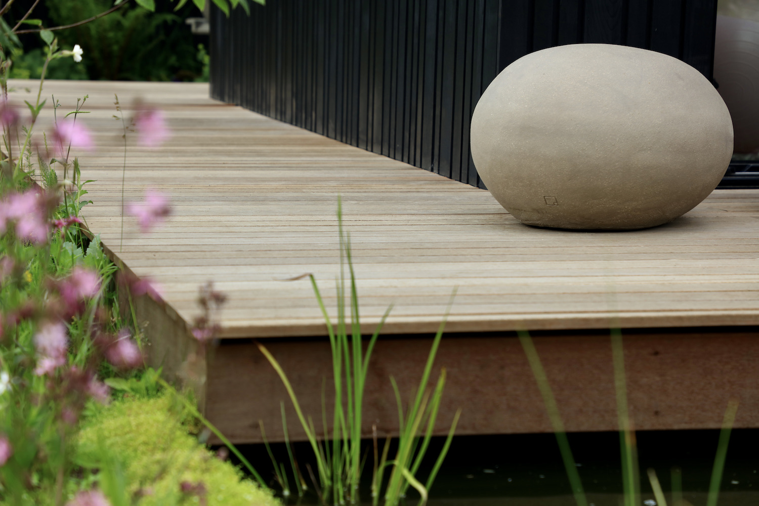 decking at Oxpod garden in townhouse garden with atelier pebbles and prairie planting 