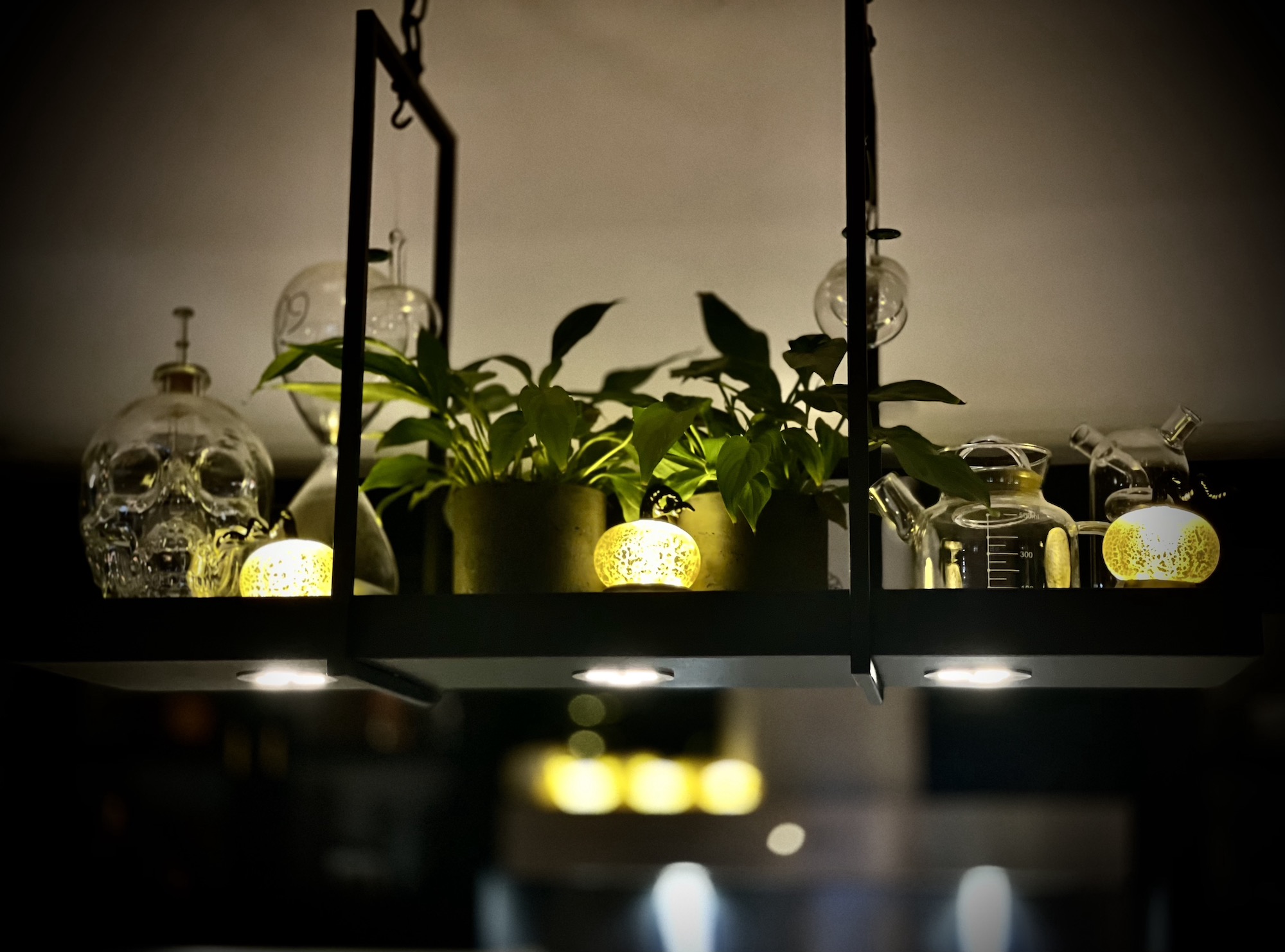 Hanging tablescape with pumpkin lights and skull glassware