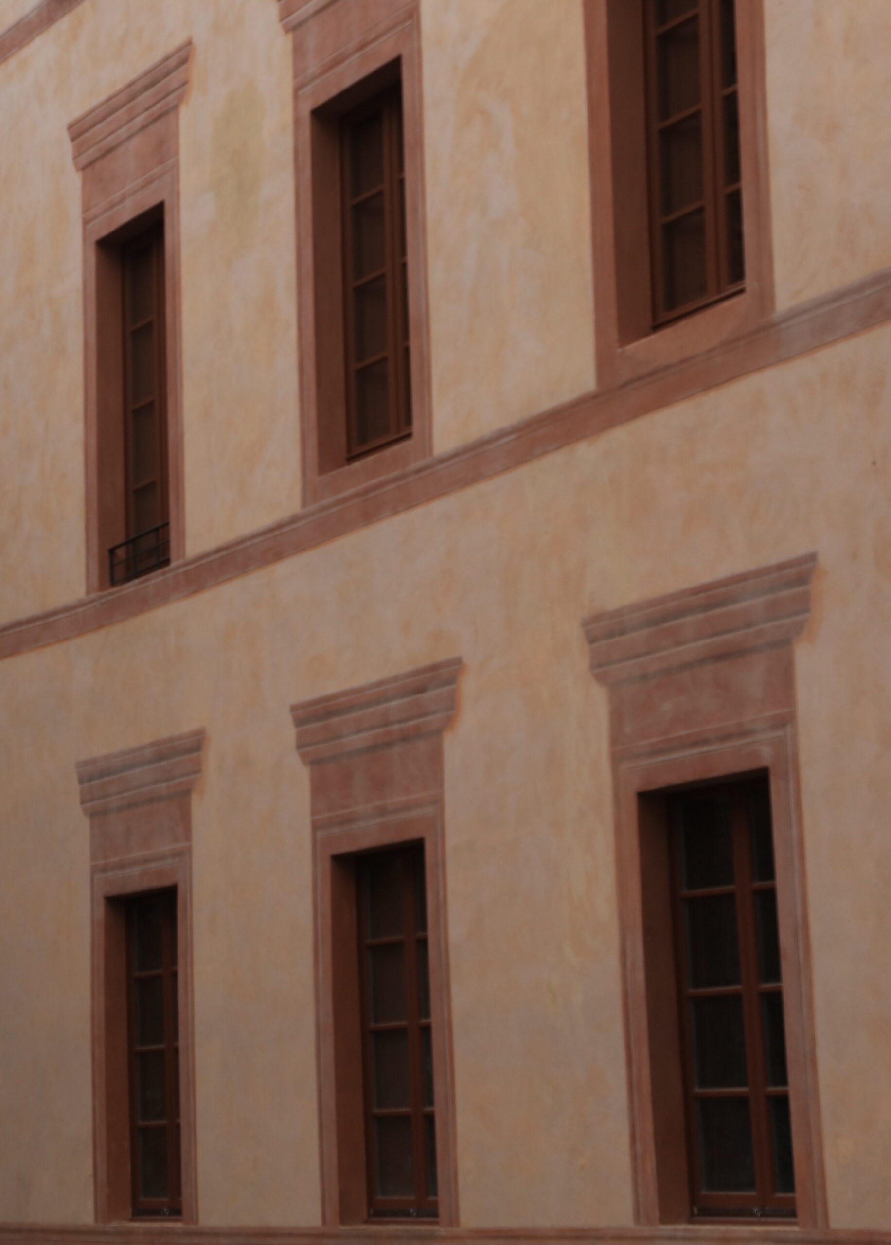 Italian sash windows in terracotta and plaster