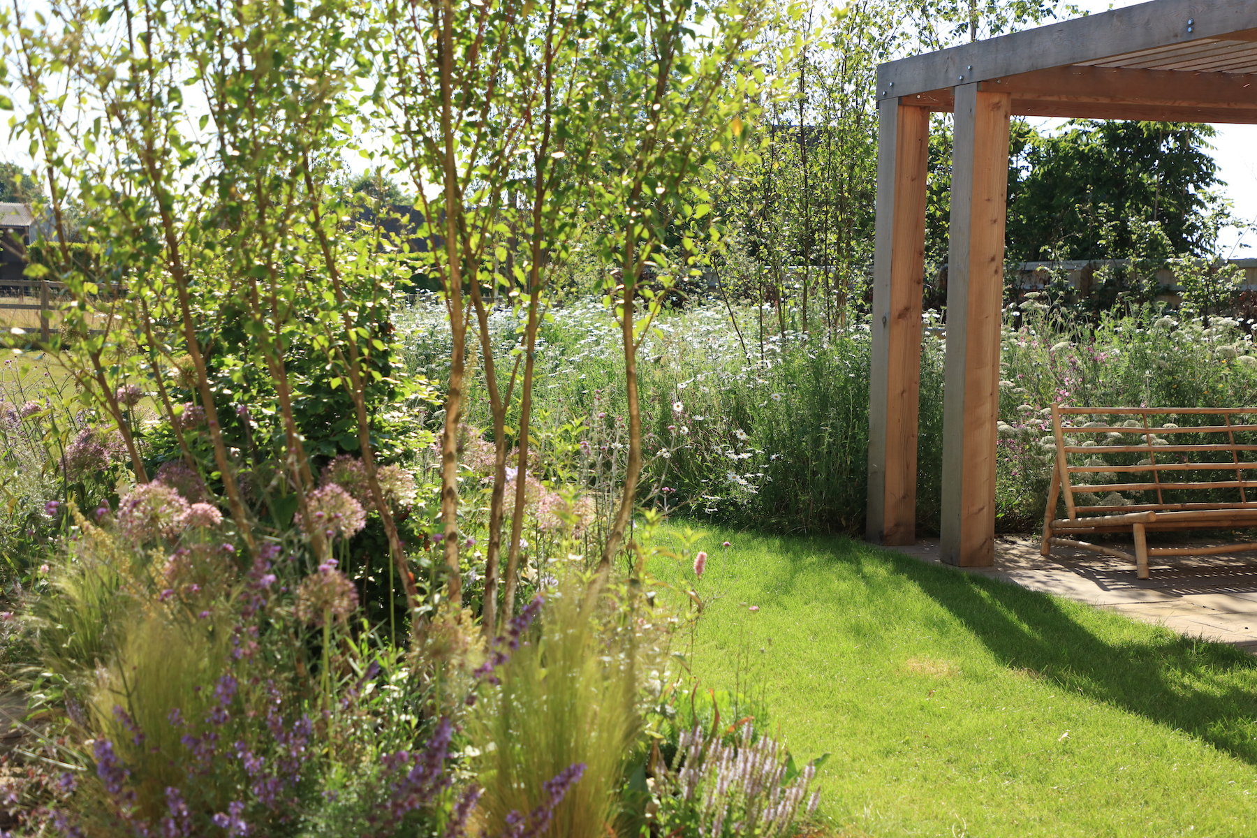 Sustainable cotswold garden with douglas fir arbor