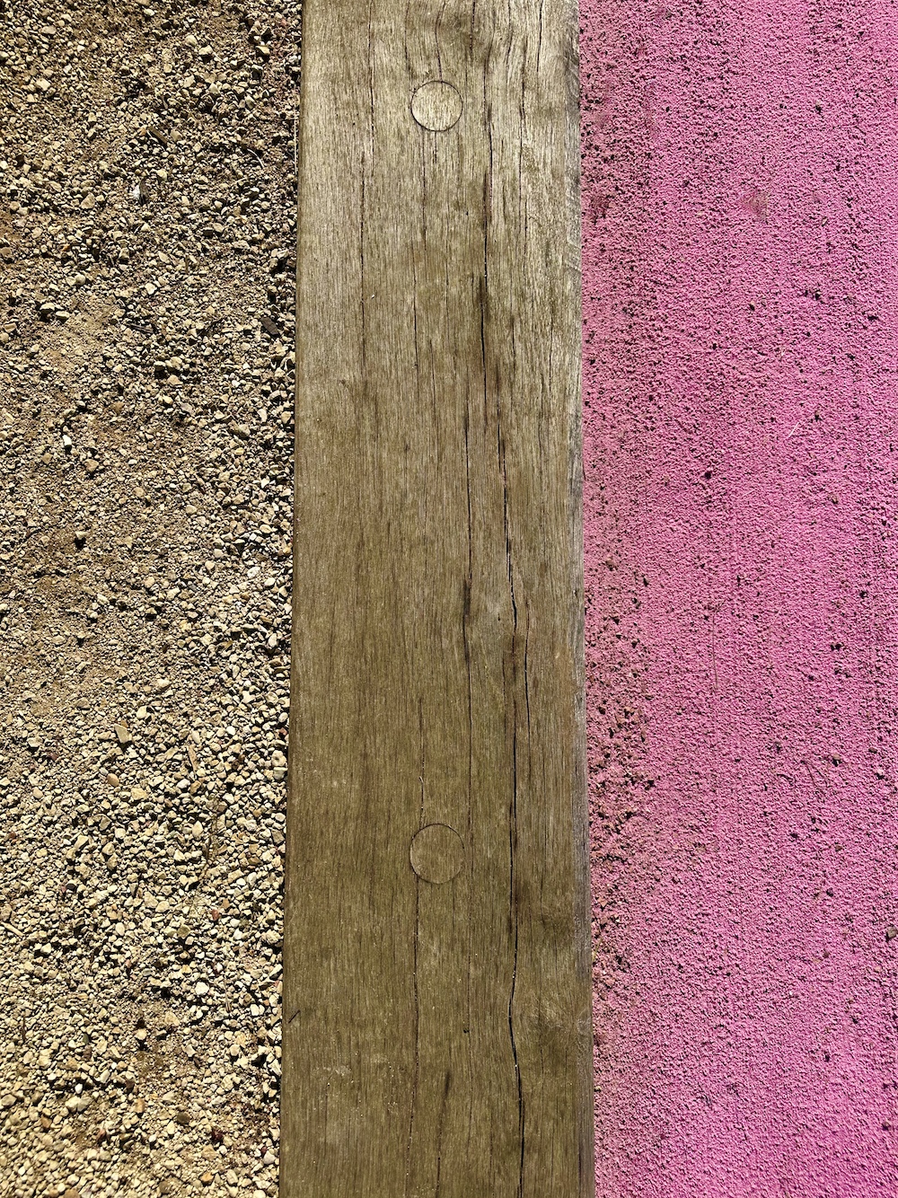 Pink bocce court, abstract close up